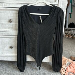 Black and gold bodysuit